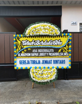 Papan Bunga Duka di Woloan Dua